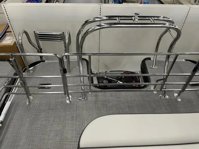 Slide: The Image of 2023 Starcraft EX 22 Q boat with stainless steel railing and ladder. - 19