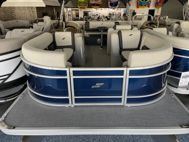 Slide: The Image of 2023 Starcraft EX 22 Q pontoon boat with spacious seating and modern design. - 2