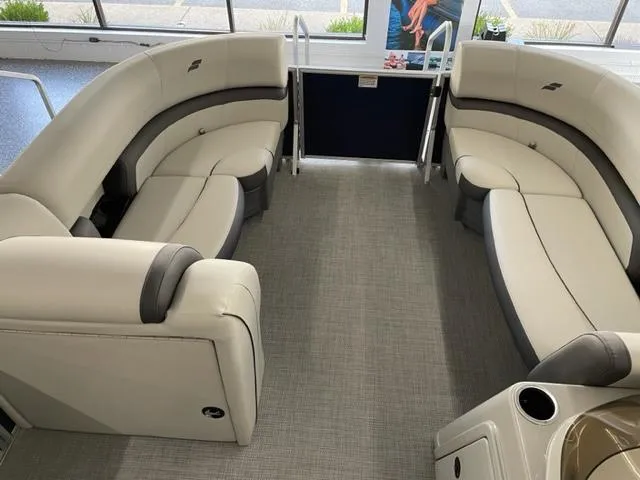 Slide: The Image of 2023 Starcraft EX 22 Q pontoon boat interior with plush seating. - 4