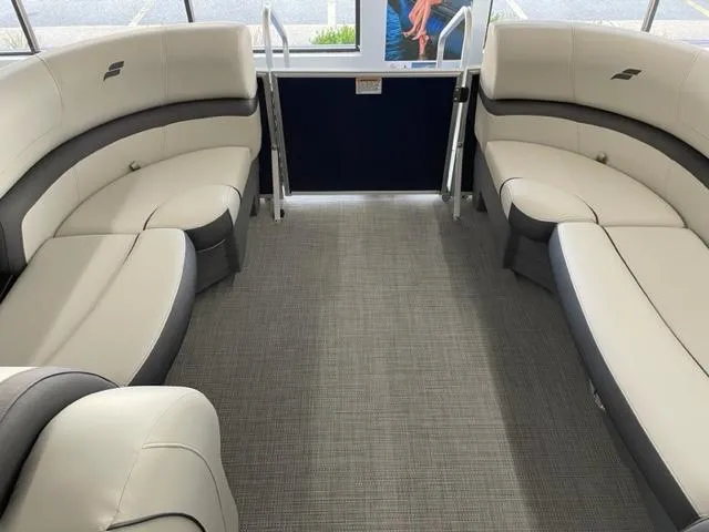 Slide: The Image of 2023 Starcraft EX 22 Q boat interior with plush seating and modern design. - 6
