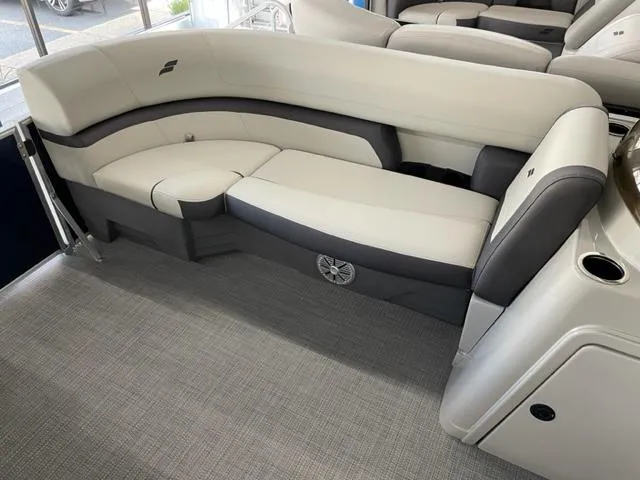 Slide: The Image of 2023 Starcraft EX 22 Q boat interior with cushioned seating. - 7