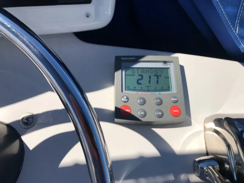 Slide: The Image of Dashboard of 2006 Tiara Yachts 3800 Open with navigation controls and display. - 19