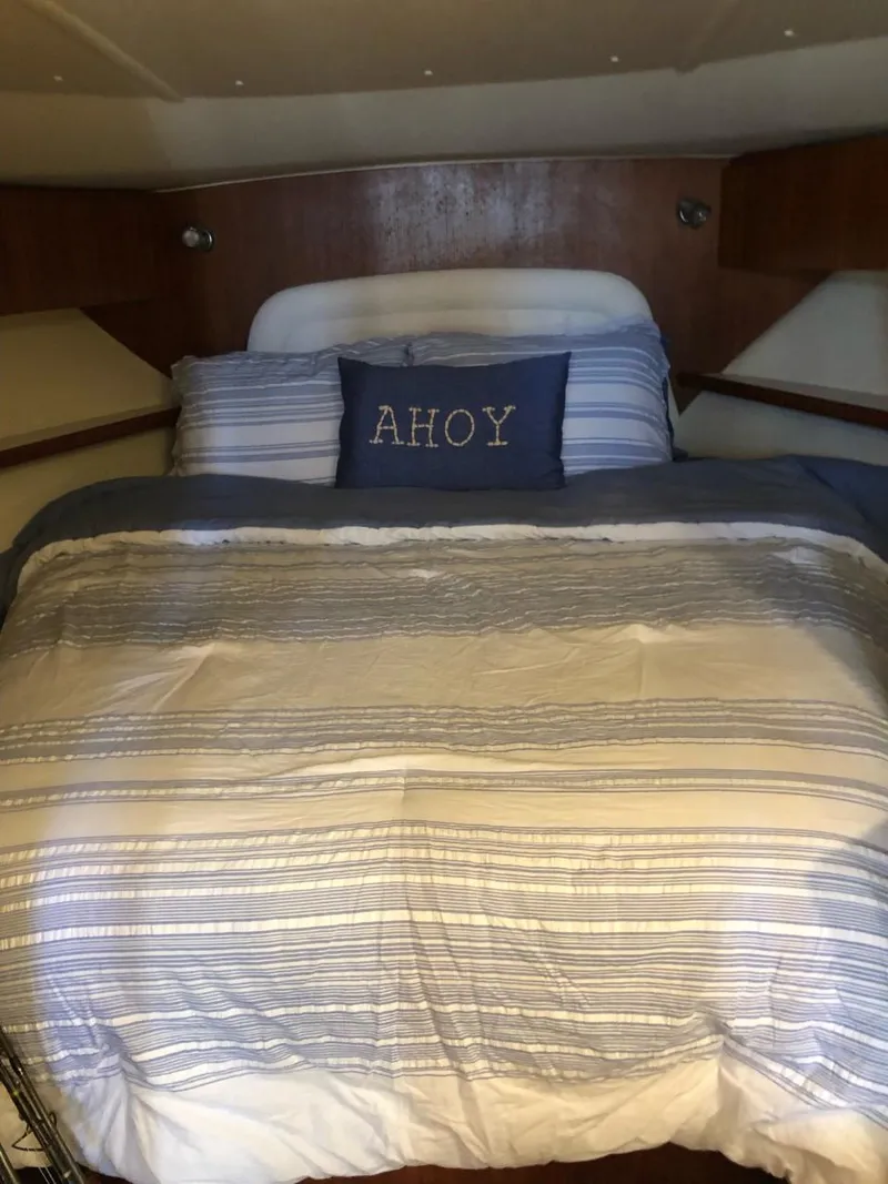 Slide: The Image of Cozy cabin bed in 2006 Tiara Yachts 3800 Open with nautical-themed "Ahoy" pillow. - 23