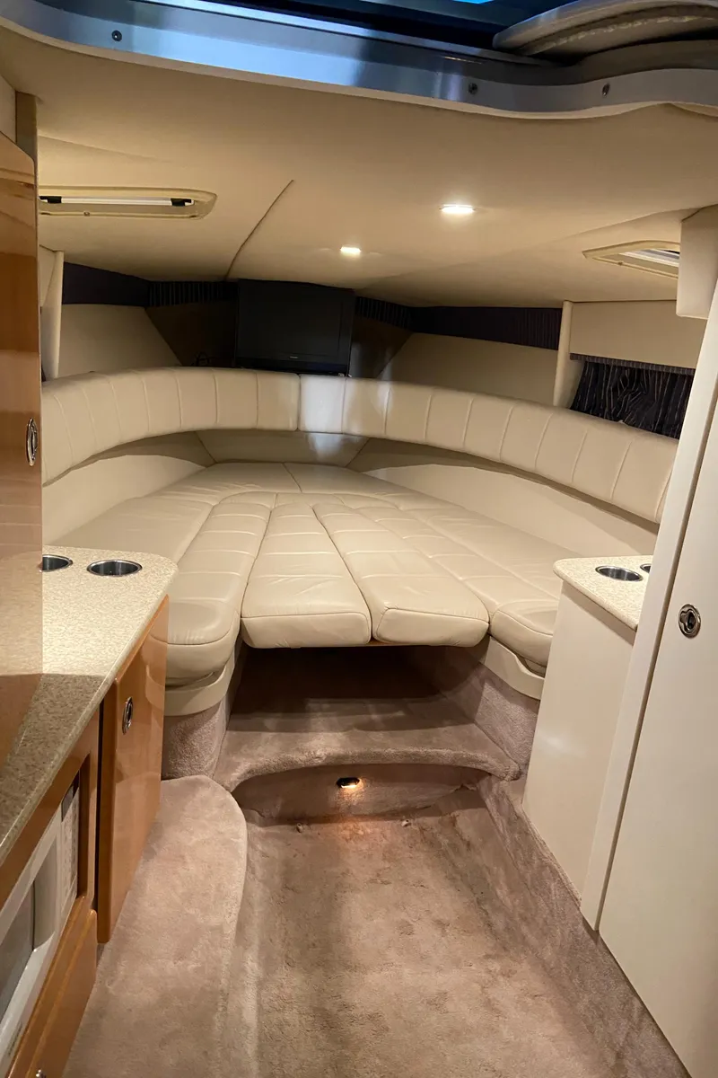 Slide: The Image of 2003 Formula 330 Sun Sport cabin interior with beige seating and modern amenities. - 13