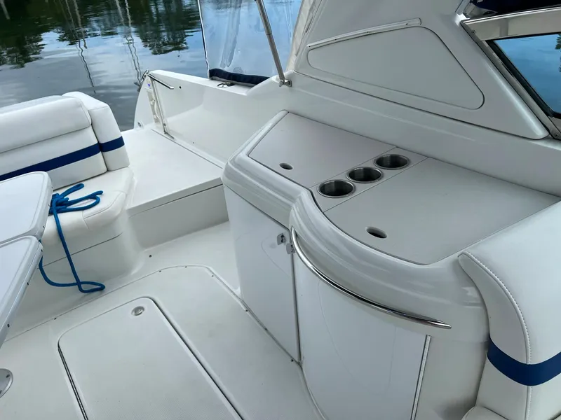 Slide: The Image of 2003 Formula 330 Sun Sport boat interior with seating and cup holders. - 7