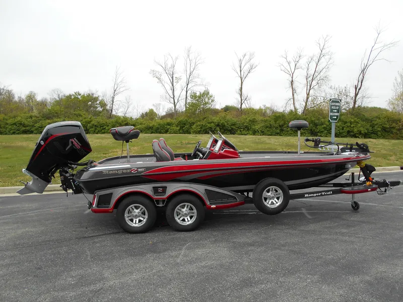 Slide: The Image of 2023 Ranger Z520R bass boat on trailer, black and red, side view. - 0