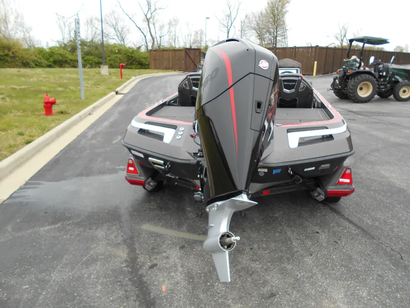Slide: The Image of 2023 Ranger Z520R boat with outboard motor, rear view in parking lot. - 1