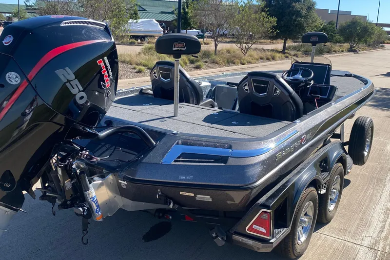 Slide: The Image of 2023 Ranger Z520R boat on trailer, parked on a paved road, side view. - 4