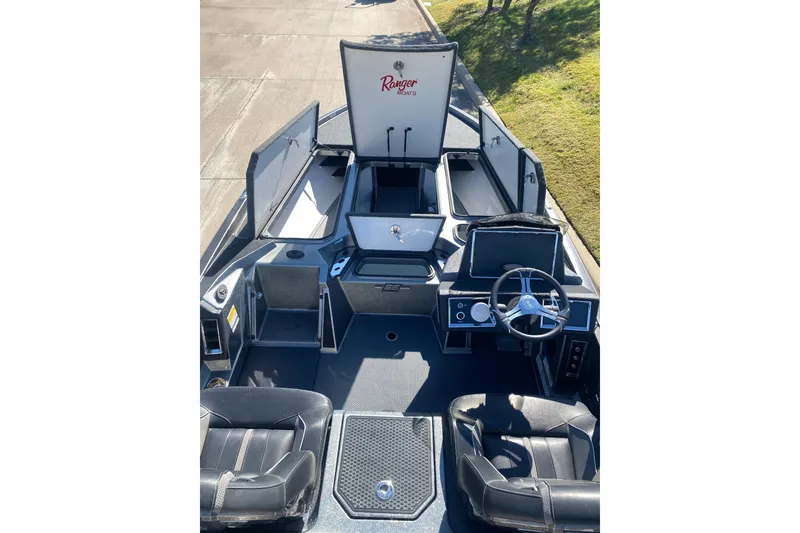 Slide: The Image of 2023 Ranger Z520R boat deck with storage compartments and control panel. - 6