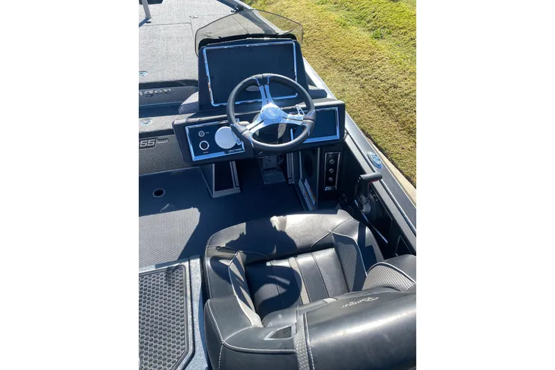 Slide: The Image of 2023 Ranger Z520R boat interior with dual seats and steering console. - 9
