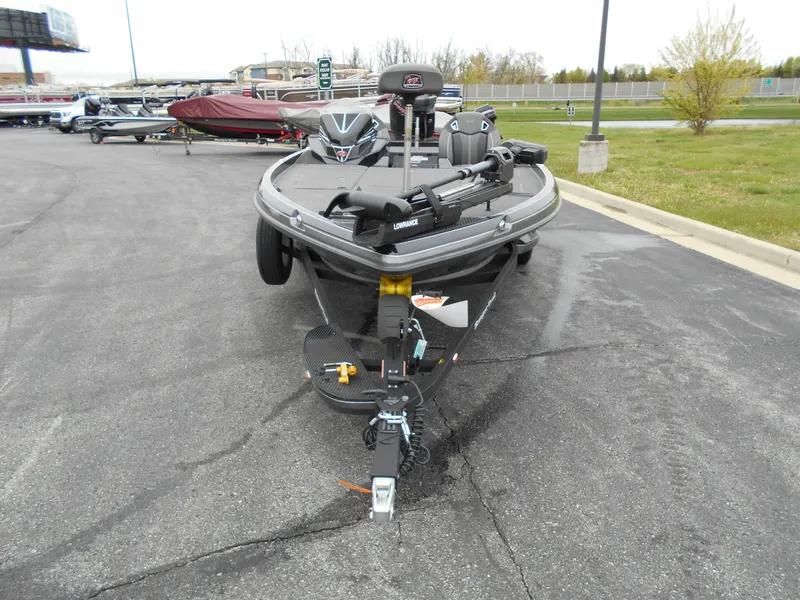 Slide: The Image of 2023 Ranger Z520R fishing boat on trailer in parking lot. - 2