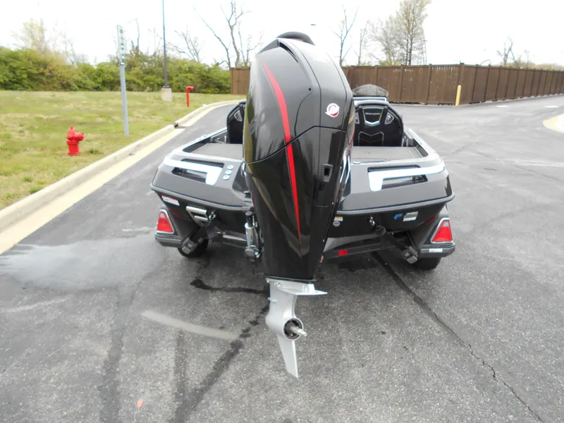 Slide: The Image of 2023 Ranger Z520R boat with outboard motor, rear view on pavement. - 3