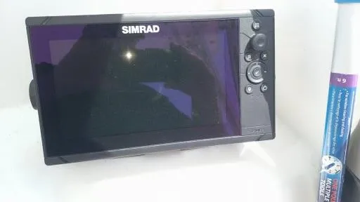 Slide: The Image of Simrad marine GPS device on a 2001 Seaswirl Striper 2600 Sport Cabin I/O boat. - 13
