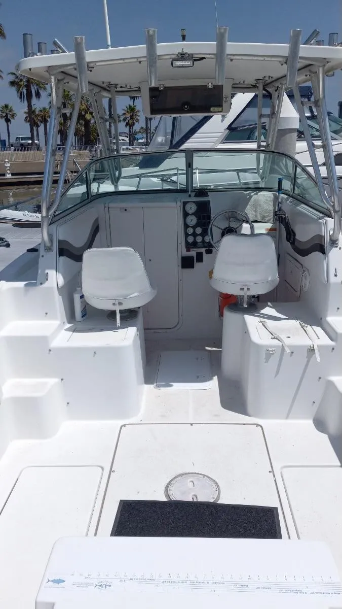 Slide: The Image of 2001 Seaswirl Striper 2600 Sport Cabin I/O boat interior with seating and control panel. - 18