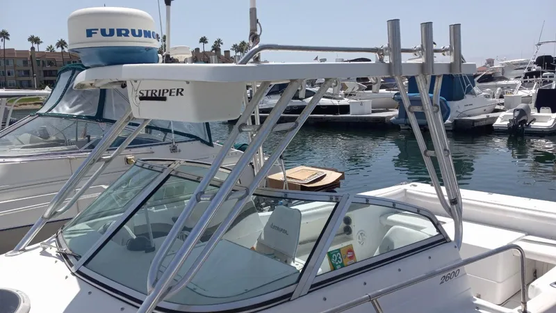 Slide: The Image of 2001 Seaswirl Striper 2600 Sport Cabin I/O docked in a marina. - 4