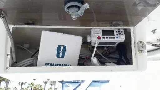Slide: The Image of 2001 Seaswirl Striper 2600 Sport Cabin I/O electronics compartment with Furuno equipment. - 5