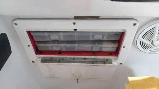 Slide: The Image of 2001 Seaswirl Striper 2600 Sport Cabin I/O storage compartment with speaker detail. - 7