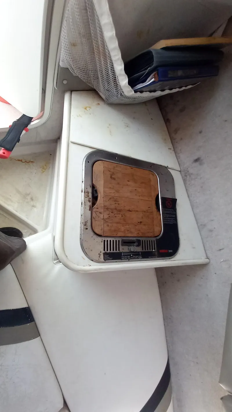 Slide: The Image of 2001 Seaswirl Striper 2600 Sport Cabin I/O interior with storage compartment. - 8