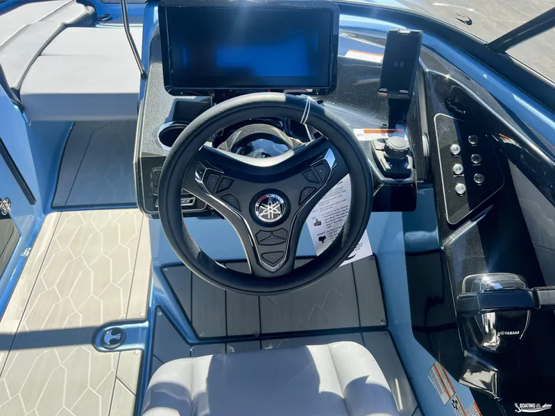 Slide: The Image of 2025 Yamaha Boats 255XD steering console with modern controls and touchscreen display. - 5