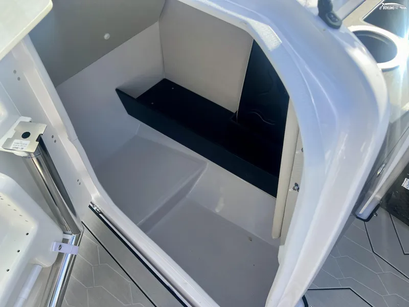 Slide: The Image of Interior view of 2025 Yamaha Boats 252XE storage compartment. - 6