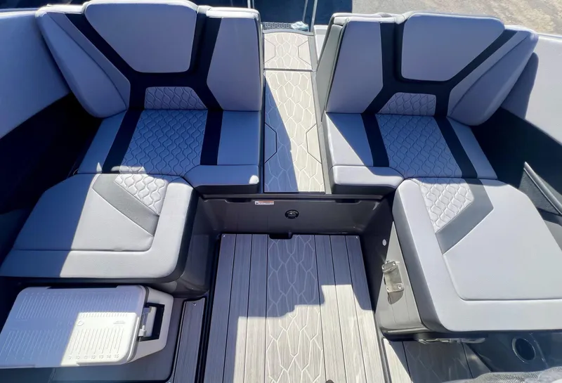 Slide: The Image of 2025 Yamaha Boats 222XE interior seating with modern design and textured flooring. - 2