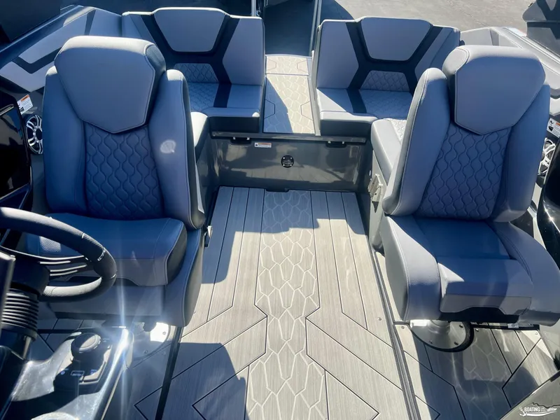 Slide: The Image of Interior of 2025 Yamaha Boats 222XE with modern seating and sleek flooring. - 4