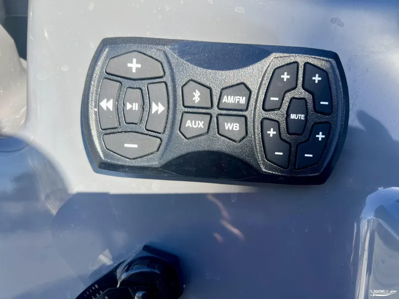 Slide: The Image of Yamaha Boats 2025 222XE audio control panel with various function buttons. - 7
