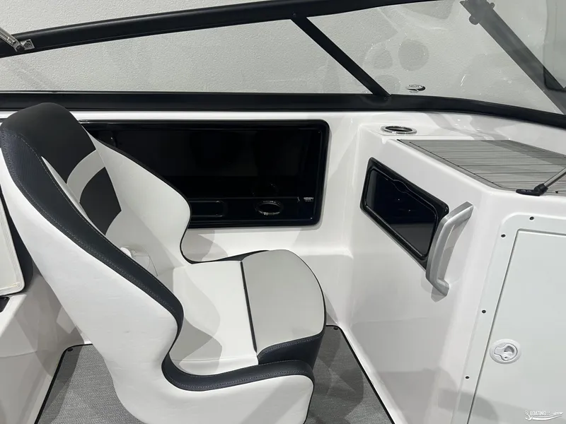 Slide: The Image of 2024 Yamaha Boats SX195 interior with sleek seating and modern dashboard design. - 8