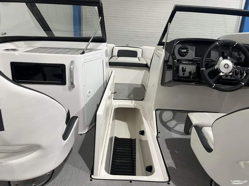 Slide: The Image of 2024 Yamaha Boats SX195 interior with steering wheel and seating area. - 9
