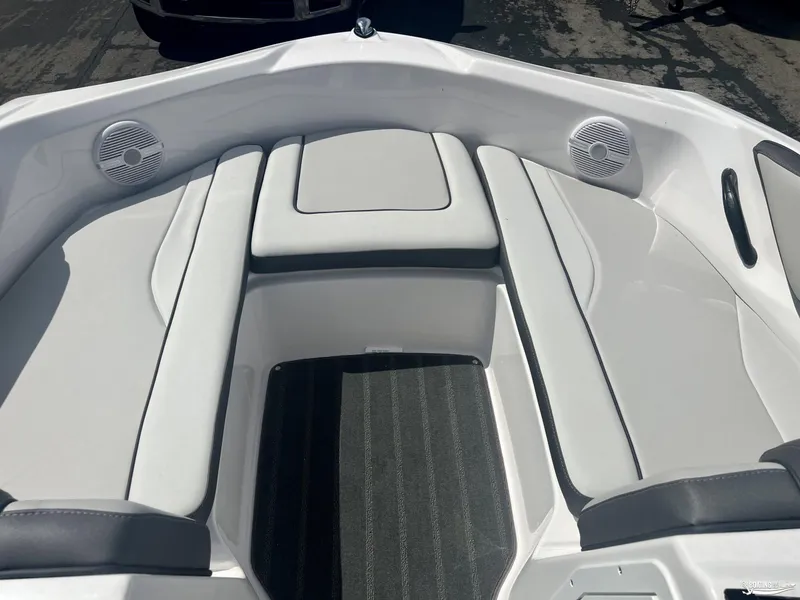 Slide: The Image of 2024 Yamaha AR190 boat interior with cushioned seating and speakers. - 2