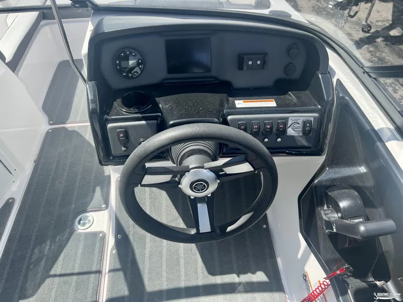 Slide: The Image of 2024 Yamaha Boats AR190 dashboard with steering wheel and control panel. - 6