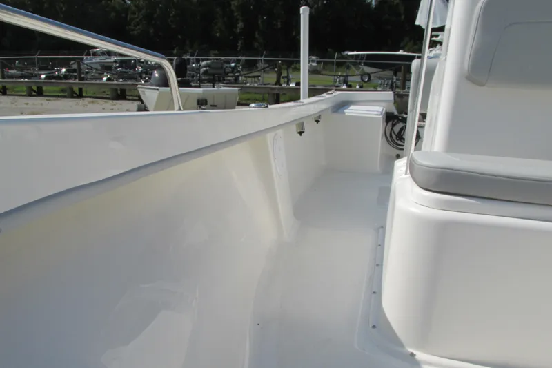 Slide: The Image of 2023 May-Craft 1900CC boat interior, white deck and seating area. - 12