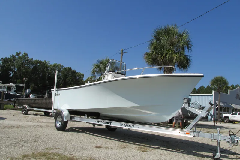 Slide: The Image of 2023 May-Craft 1900CC boat on a trailer, parked outdoors. - 3