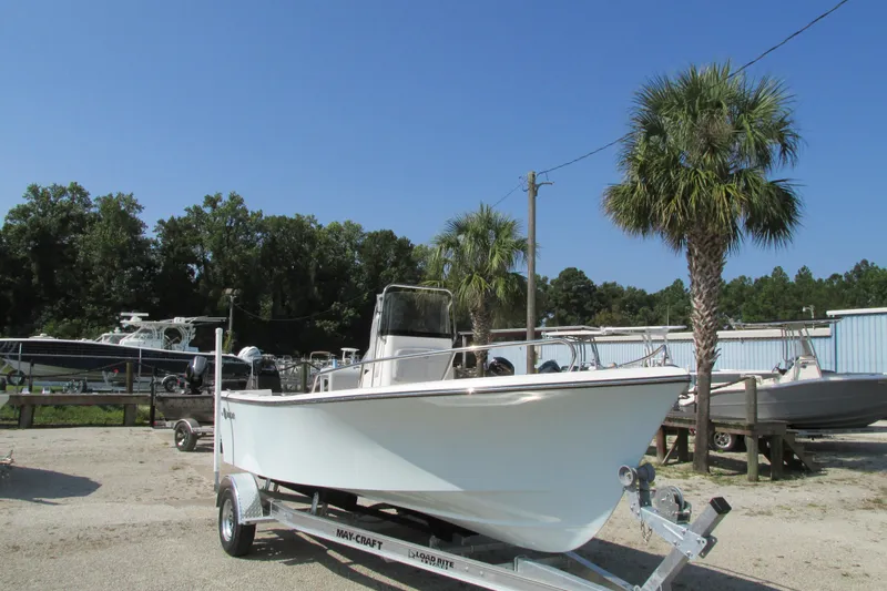 Slide: The Image of 2023 May-Craft 1900CC boat on a trailer in a sunny outdoor setting. - 4