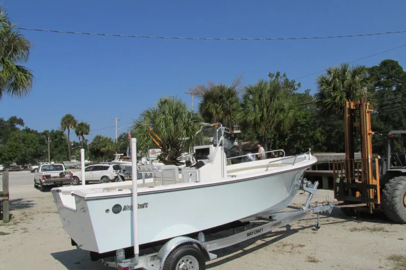 Slide: The Image of 2023 May-Craft 1900CC boat on a trailer in a sunny outdoor setting. - 5
