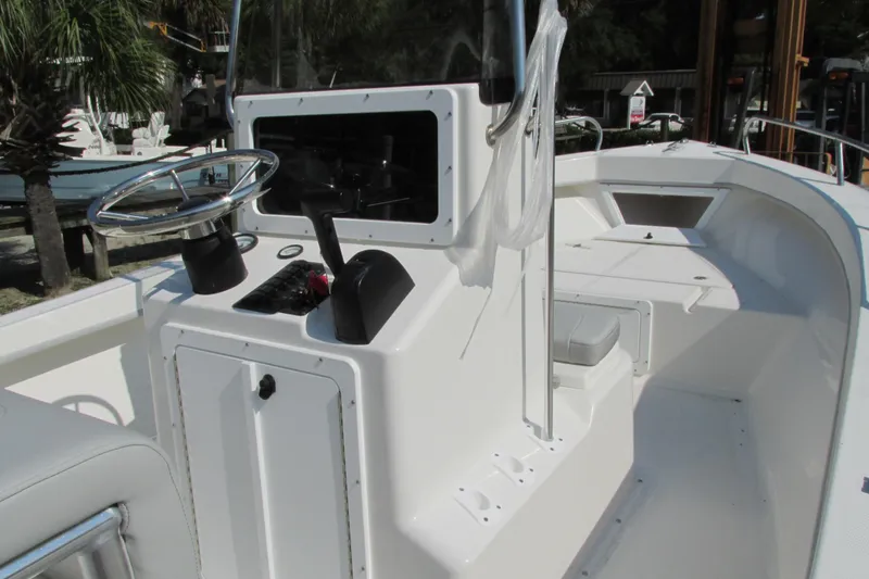 Slide: The Image of 2023 May-Craft 1900CC center console boat with steering wheel and control panel. - 9