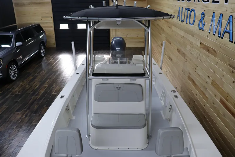 Slide: The Image of 2023 May-Craft 23 Cape Classic boat interior with seating and console. - 5