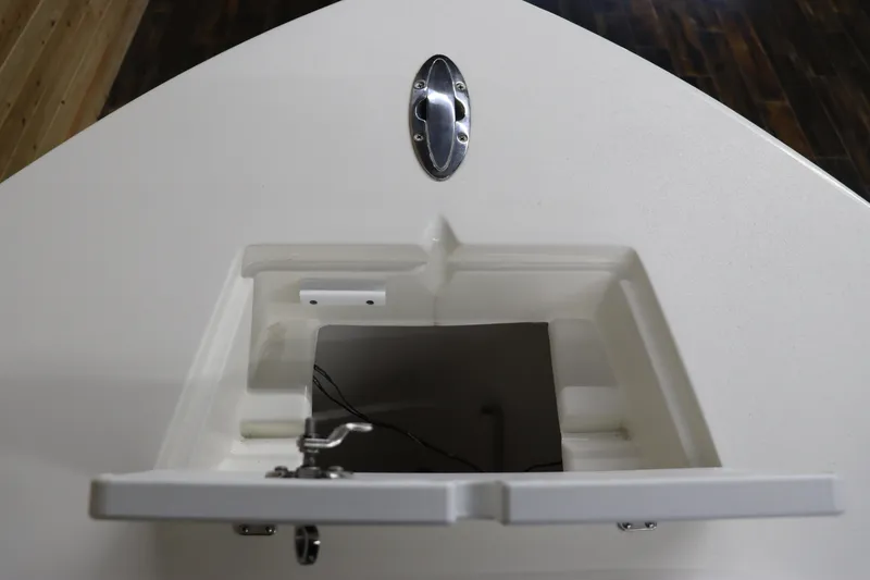 Slide: The Image of 2023 May-Craft 23 Cape Classic boat storage compartment with open hatch. - 6