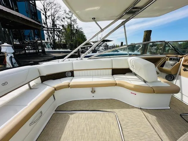 Slide: The Image of 2015 Cobalt 302 boat interior with white and tan seating. - 10