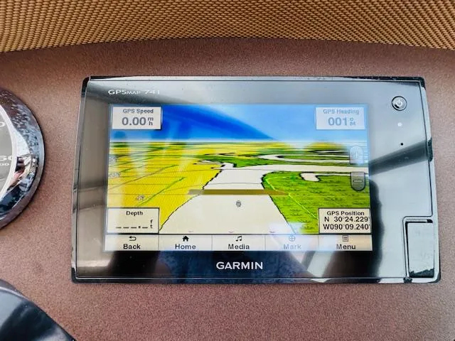 Slide: The Image of Garmin GPS display in a 2015 Cobalt 302 boat showing navigation map. - 17