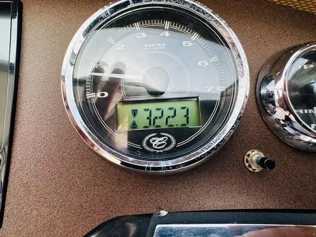 Slide: The Image of Close-up of 2015 Cobalt 302 boat tachometer showing 322.3 hours. - 18