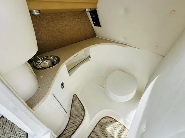 Slide: The Image of 2015 Cobalt 302 boat interior bathroom with sink and toilet. - 20