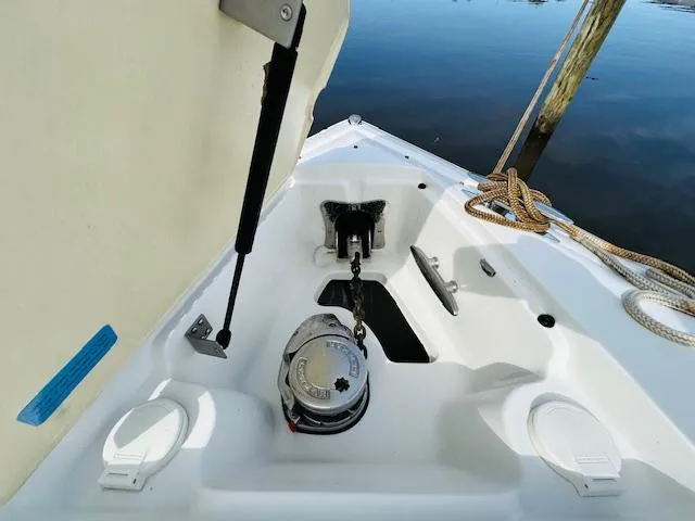Slide: The Image of Anchor compartment of a 2015 Cobalt 302 boat with ropes and winch. - 25