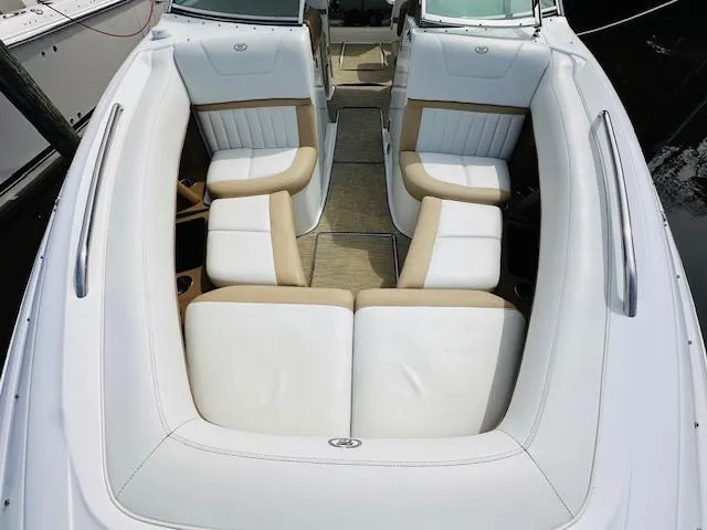 Slide: The Image of 2015 Cobalt 302 boat with white and beige leather seating. - 26