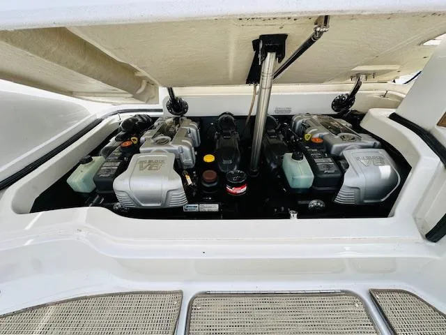Slide: The Image of 2015 Cobalt 302 boat engine compartment with dual V8 engines. - 32