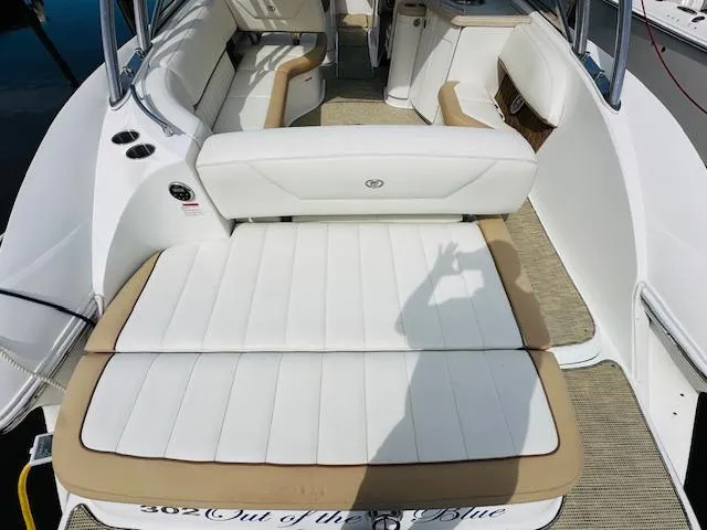 Slide: The Image of 2015 Cobalt 302 boat interior with white and tan seating. - 6