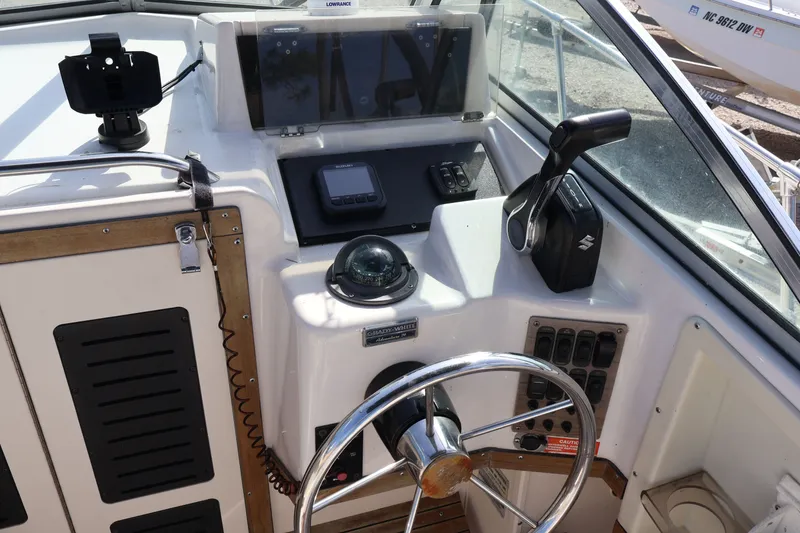 Slide: The Image of Cockpit of a 1994 Grady-White Adventure 208 boat. - 10