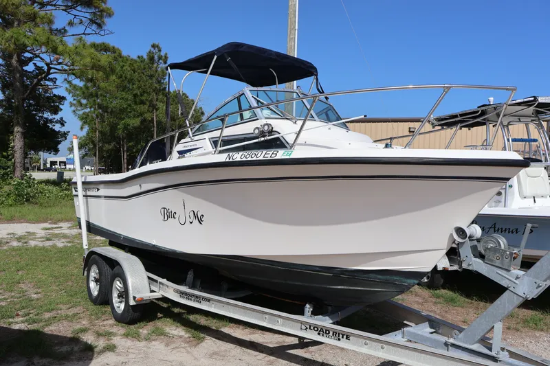 Slide: The Image of 1994 Grady-White Adventure 208 boat on trailer outdoors. - 3