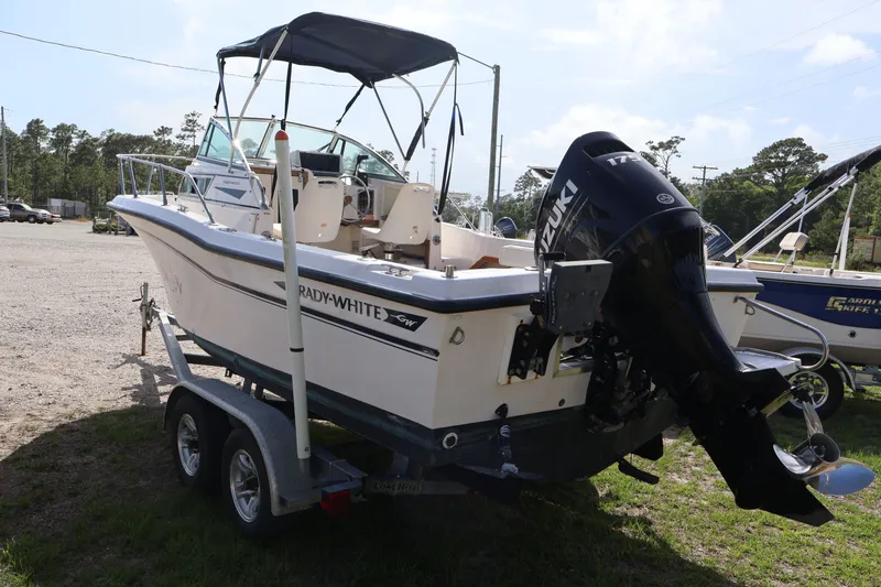 Slide: The Image of 1994 Grady-White Adventure 208 boat with Suzuki engine on trailer. - 6