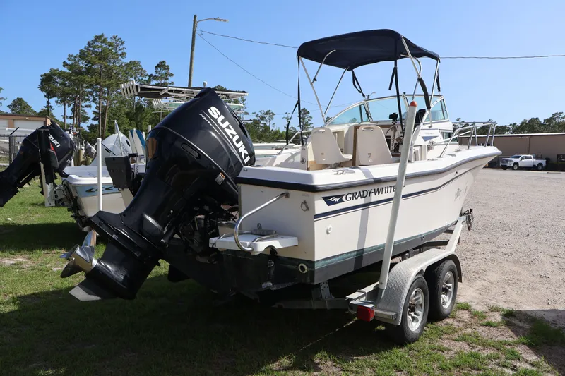 Slide: The Image of 1994 Grady-White Adventure 208 boat with Suzuki outboard motor. - 8